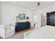 Bright and airy main bedroom with a dresser, seating, and access to the main bathroom at 2568 Helmsman Rd, Johns Island, SC 29455