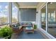 Relaxing screened porch featuring comfortable seating, stylish decor, and serene outdoor views at 2568 Helmsman Rd, Johns Island, SC 29455
