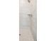 Modern shower with stylish gray tiling, a built-in shelf, and a sleek shower head at 2568 Helmsman Rd, Johns Island, SC 29455