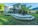 Spacious backyard featuring a patio with fire pit and an adjacent screened porch, ideal for outdoor enjoyment at 2668 Private Lefler Dr, Johns Island, SC 29455