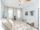 Bright bedroom with neutral decor, lots of natural light, ceiling fan and decorative side tables at 2668 Private Lefler Dr, Johns Island, SC 29455