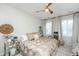 Bright bedroom with neutral decor, lots of natural light, ceiling fan and decorative side tables at 2668 Private Lefler Dr, Johns Island, SC 29455