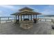 Charming gazebo on a wooden deck, providing a relaxing spot to enjoy water views and community amenities at 2668 Private Lefler Dr, Johns Island, SC 29455