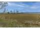Overlook featuring views of the marsh, pier and watercraft at 2668 Private Lefler Dr, Johns Island, SC 29455