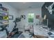 Cozy office space with a desk, exercise bike, and shelf, perfect for work and fitness at 2668 Private Lefler Dr, Johns Island, SC 29455