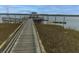 Walking pier into the marsh with a gazebo at the end and a dock for small boats at 2668 Private Lefler Dr, Johns Island, SC 29455