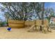 Fun community playground with a wooden pirate ship, slide, and climbing structures for enjoyment at 2668 Private Lefler Dr, Johns Island, SC 29455