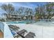 A resort-style pool with ample seating, a wading pool, and mature shade trees, from another angle at 2668 Private Lefler Dr, Johns Island, SC 29455