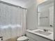 Bright bathroom featuring a stylish vanity, modern fixtures, and a colorful shower curtain at 2889 Backman St, Mount Pleasant, SC 29466