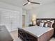 Well-lit bedroom with a ceiling fan, closet, and a decorative lamp on a nightstand by the bed at 2889 Backman St, Mount Pleasant, SC 29466