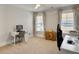 Cozy bedroom featuring a ceiling fan, two large windows, and neutral carpet flooring at 2889 Backman St, Mount Pleasant, SC 29466