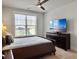 Comfortable bedroom showcasing a ceiling fan and a large window providing natural light at 2889 Backman St, Mount Pleasant, SC 29466