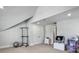 Spacious bonus room with minimalist design, including exercise equipment and storage solutions at 2889 Backman St, Mount Pleasant, SC 29466
