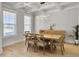 Modern dining room with coffered ceilings, modern light fixture, and hardwood floors at 2889 Backman St, Mount Pleasant, SC 29466