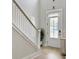 Bright entryway with stairway access, a light fixture and a decorative chest at 2889 Backman St, Mount Pleasant, SC 29466