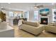 Open-concept layout with a living room, kitchen, and dining area filled with natural light at 2889 Backman St, Mount Pleasant, SC 29466