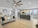 Open living space offers modern decor, hardwood floors, and views of the kitchen at 2889 Backman St, Mount Pleasant, SC 29466