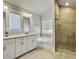 Elegant main bathroom featuring dual sinks, a large bathtub, and a separate glass-enclosed shower at 2889 Backman St, Mount Pleasant, SC 29466