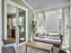 Cozy sunroom with a couch, table, and sheer curtains, creating a relaxing outdoor atmosphere at 2889 Backman St, Mount Pleasant, SC 29466