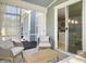 Inviting sunroom with wicker chairs, a coffee table, and sheer curtains, creating a relaxing retreat at 2889 Backman St, Mount Pleasant, SC 29466