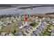 Aerial view of a waterfront community showcasing beautiful homes, green spaces, and easy access to the water at 2906 Quarterdeck Ct, Mount Pleasant, SC 29466