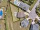 Aerial view of a landscaped yard with a pool, patio, and pond at 2906 Quarterdeck Ct, Mount Pleasant, SC 29466