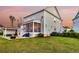 Spacious backyard with patio area, fire pit, outdoor kitchen, screened porch, and lush lawn at 2906 Quarterdeck Ct, Mount Pleasant, SC 29466