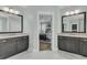Bathroom with double vanities, marble counters, and a view into the Primary bedroom at 2906 Quarterdeck Ct, Mount Pleasant, SC 29466