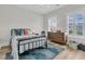 Bedroom with great natural light featuring hardwood floors, neutral walls, and comfortable furnishings at 2906 Quarterdeck Ct, Mount Pleasant, SC 29466