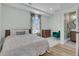 Bedroom with bed, dresser, sitting chair and ensuite bathroom at 2906 Quarterdeck Ct, Mount Pleasant, SC 29466