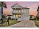 Stunning two-story home with double porches, columns, a two-car garage and a beautifully landscaped lawn at 2906 Quarterdeck Ct, Mount Pleasant, SC 29466