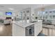 Open concept kitchen with island, modern countertops, stainless appliances, and bar stool seating at 2906 Quarterdeck Ct, Mount Pleasant, SC 29466