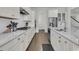 This kitchen offers stainless appliances, white countertops, hardwood floors, and ample cabinet space at 2906 Quarterdeck Ct, Mount Pleasant, SC 29466