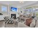 Cozy living room featuring a fireplace, comfortable seating, large windows, and elegant decor for relaxation at 2906 Quarterdeck Ct, Mount Pleasant, SC 29466