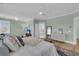 Bright bedroom with a large bed and plenty of natural light flowing into the ensuite bathroom at 2906 Quarterdeck Ct, Mount Pleasant, SC 29466