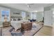 Bright main bedroom with a sitting area, complemented by a large bed and decorative rug at 2906 Quarterdeck Ct, Mount Pleasant, SC 29466