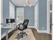 This home office features hardwood floors, natural light, and neutral paint at 2906 Quarterdeck Ct, Mount Pleasant, SC 29466