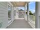 Covered porch with white railings offering an open outdoor space at 2906 Quarterdeck Ct, Mount Pleasant, SC 29466