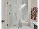 This bathroom features a marble tiled walk-in shower with a frameless glass door at 2906 Quarterdeck Ct, Mount Pleasant, SC 29466