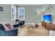 Sitting area with comfortable seating, natural light, and a modern entertainment setup at 2906 Quarterdeck Ct, Mount Pleasant, SC 29466