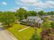 An elevated view of the home showcases its manicured lawn, lush landscaping, and proximity to the surrounding neighborhood at 310 Land O Pines Cir, Moncks Corner, SC 29461