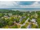 An aerial shot of the neighborhood reveals stunning waterfront views and the home's advantageous position at 310 Land O Pines Cir, Moncks Corner, SC 29461