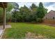 The spacious backyard includes a swing set, brick terrace and ample space for outdoor activities at 310 Land O Pines Cir, Moncks Corner, SC 29461