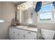 Bathroom features a neutral color scheme, white vanity, and standard toilet at 310 Land O Pines Cir, Moncks Corner, SC 29461
