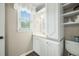 Well-lit bathroom features a white vanity, plenty of storage, and a window at 310 Land O Pines Cir, Moncks Corner, SC 29461