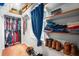 Spacious closet with built-in shelving offers ample storage for clothes and accessories at 310 Land O Pines Cir, Moncks Corner, SC 29461
