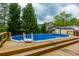 This above-ground pool features a wooden deck and ladder for easy access at 310 Land O Pines Cir, Moncks Corner, SC 29461