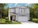 Charming two-story home featuring a well-manicured lawn and an attached two-car garage at 312 Tiliwa St, Summerville, SC 29486