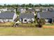 Aerial view of a home with a well-maintained backyard, including a shaded patio and fenced yard at 3133 Cold Harbor Way, Charleston, SC 29414