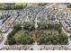 Panoramic aerial view of a residential community with homes, parks, and lakes, highlighting neighborhood layout and community spaces at 3133 Cold Harbor Way, Charleston, SC 29414